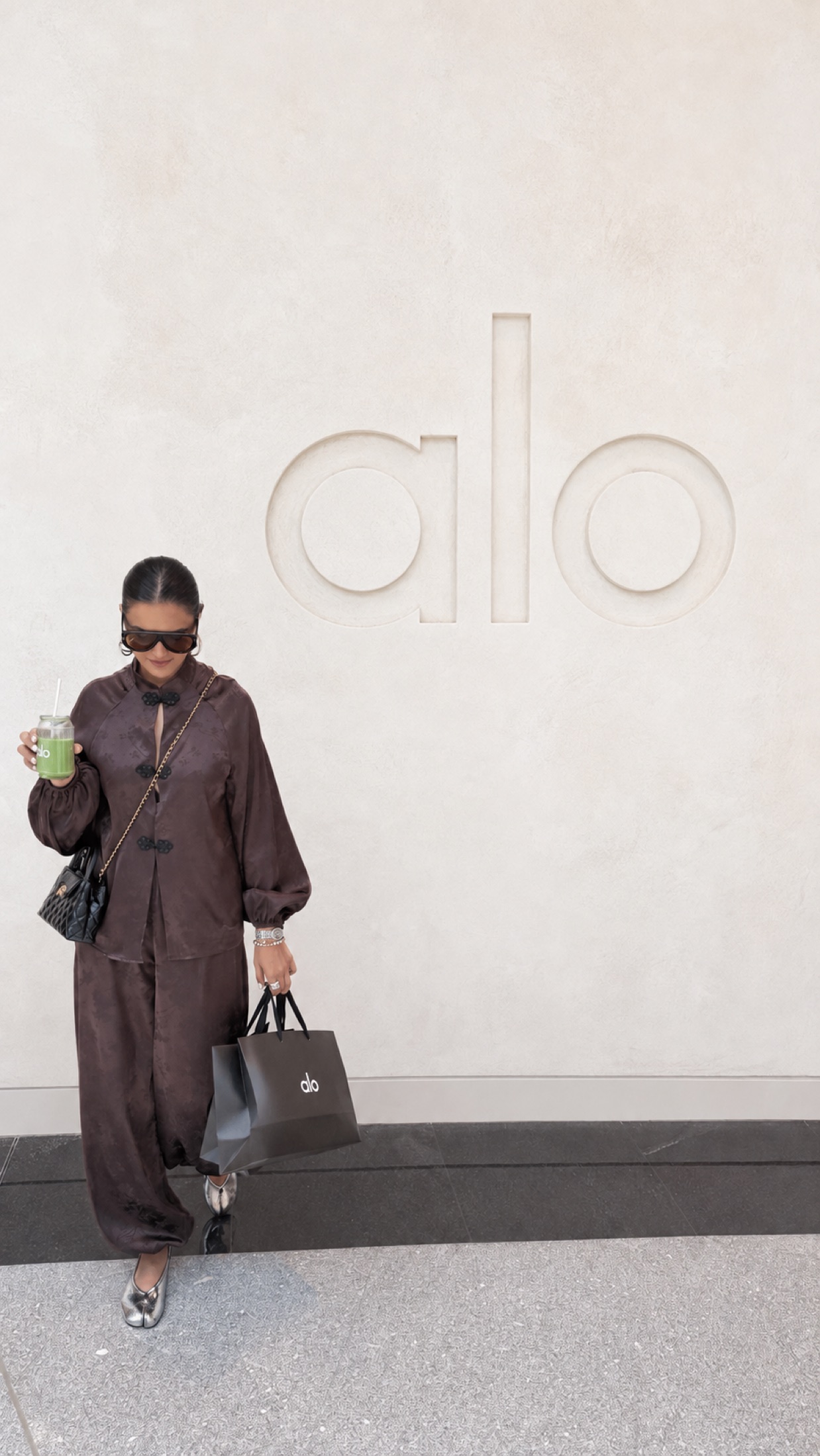 Aastha Chopra at the Alo store in Dubai with a green juice