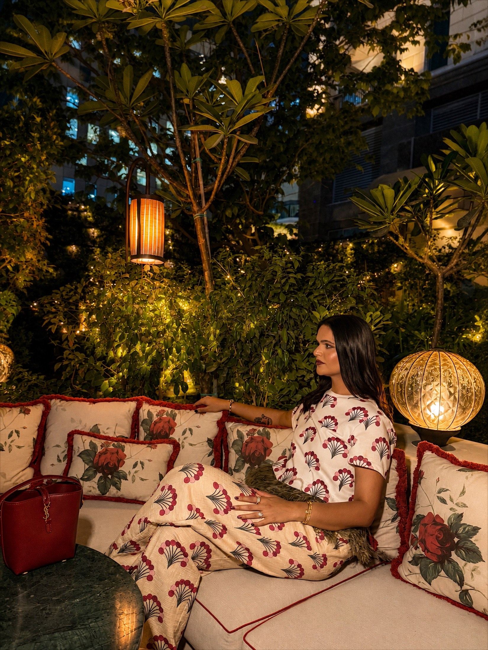 Aastha Chopra — floral print evening set on a garden terrace, Dubai