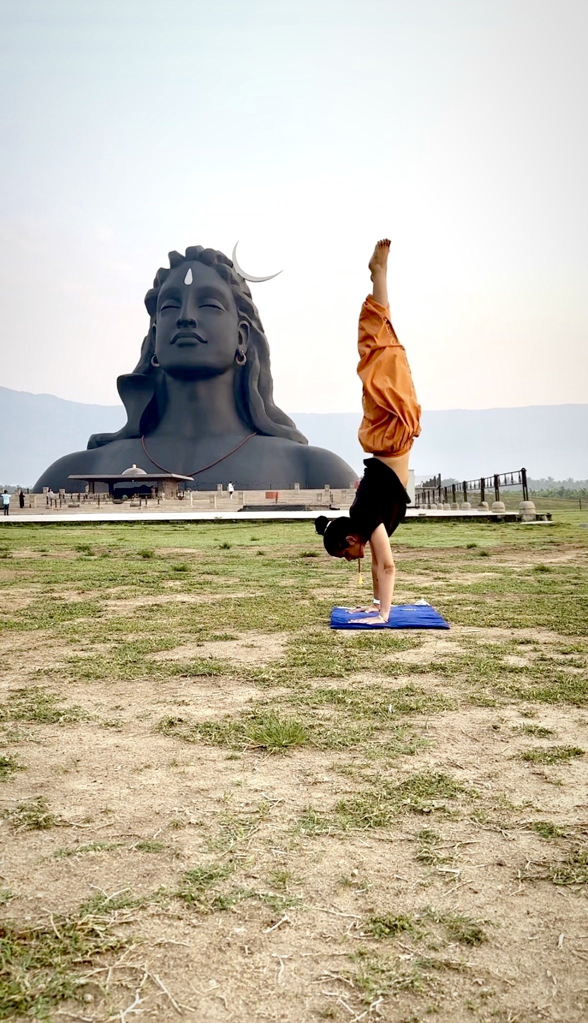 Aastha Chopra in a handstand in front of the 112-foot Adiyogi statue in Coimbatore, March 2023